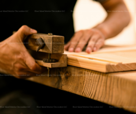 Craftsman hand-finishing custom wood joinery, River Island Interiors